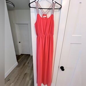 Beautiful women’s small coral short dress under with sheer top layer.